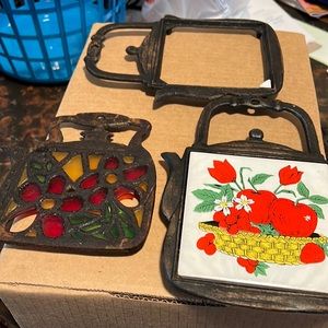 Set of three teapot cast iron trivets, as is